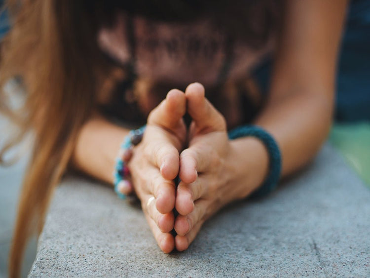women yoga pose wearing bracelets