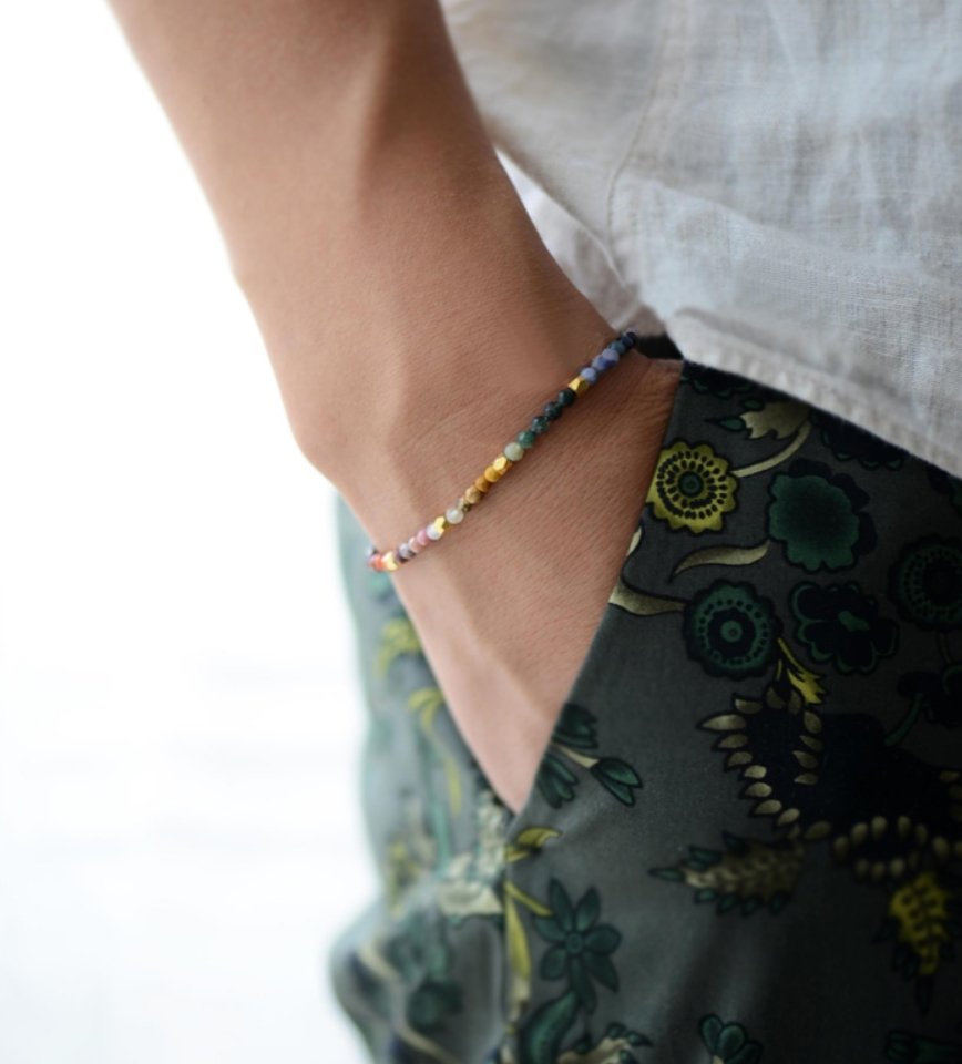 A person wearing the natural stone beaded bracelet from Egret Jewellery